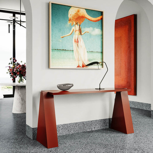 Minimalist console tables styled behind a sofa
