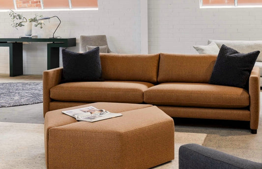 Neutral-toned modern couch in a light-filled Melbourne living room