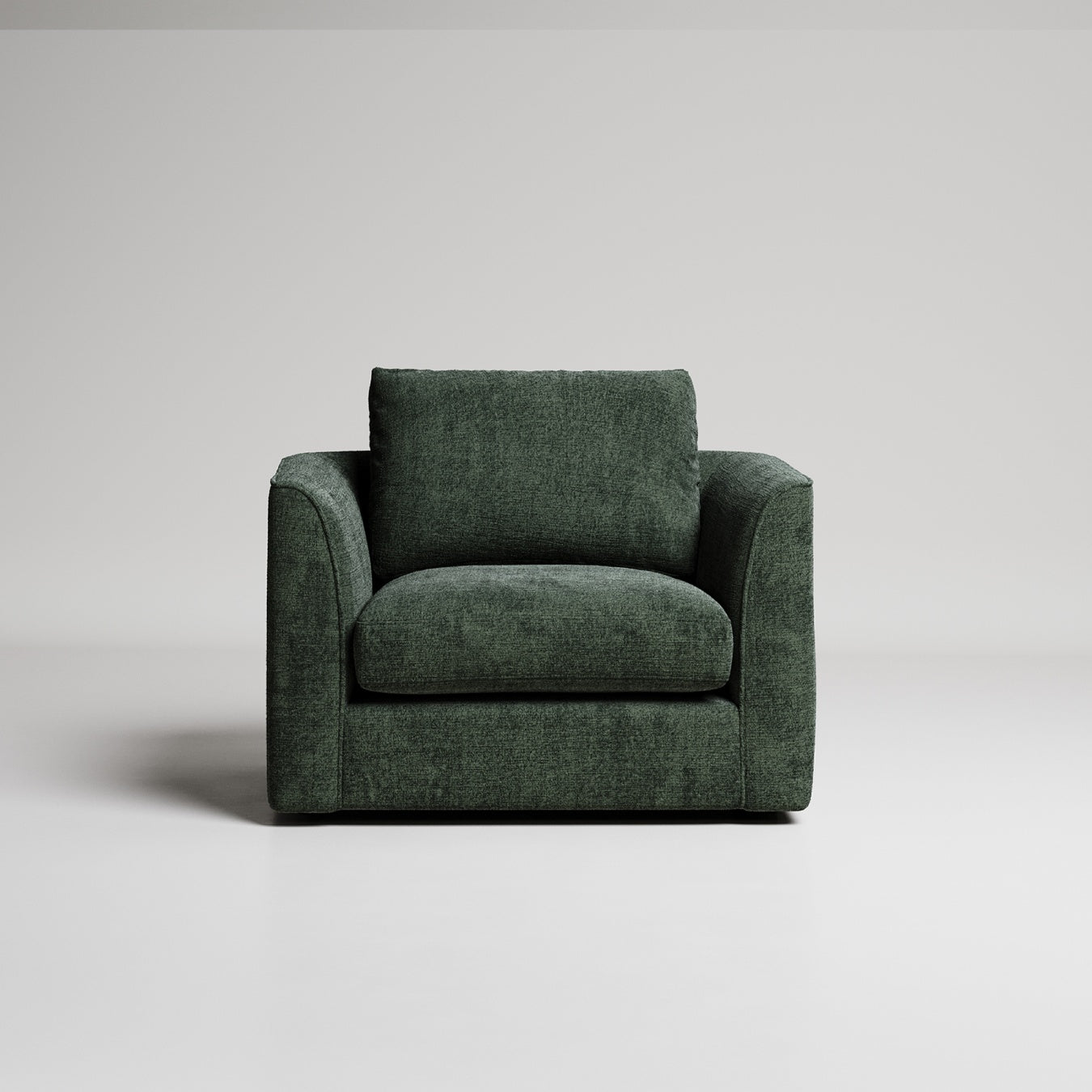 Modern dark green armchair with clean lines and textured fabric upholstery against light gray background