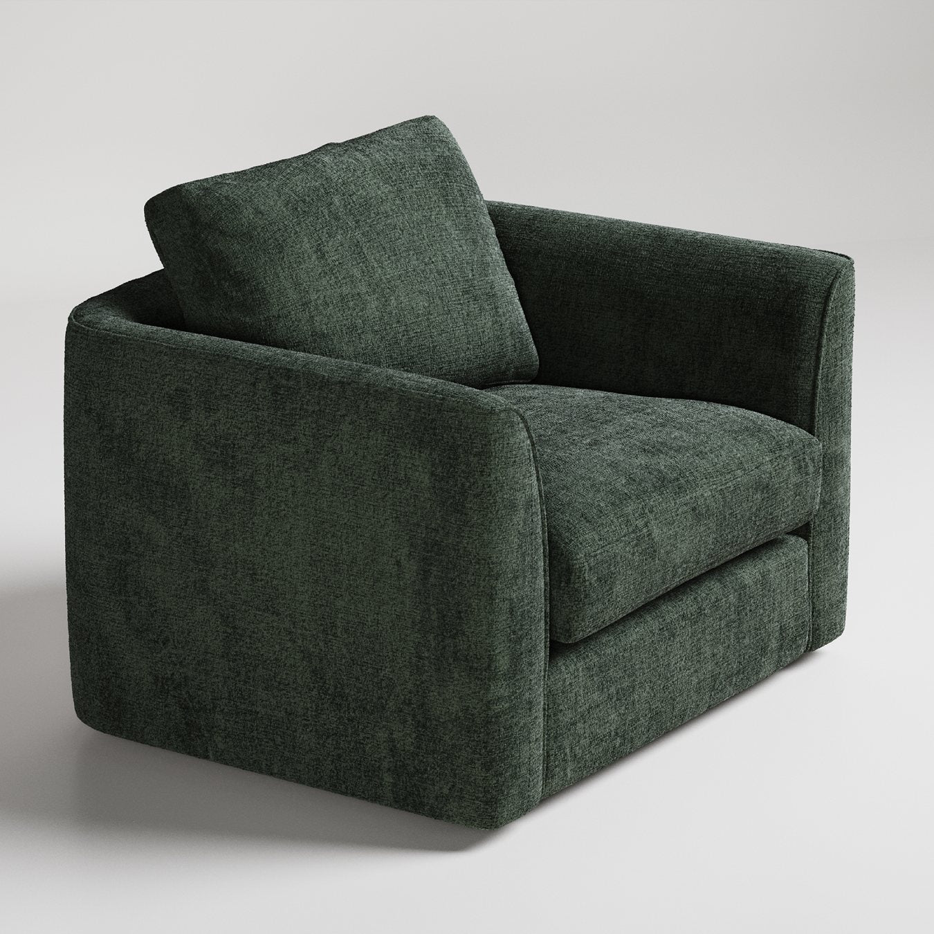 Modern forest green velvet armchair with clean lines and plush cushioning against light gray background
