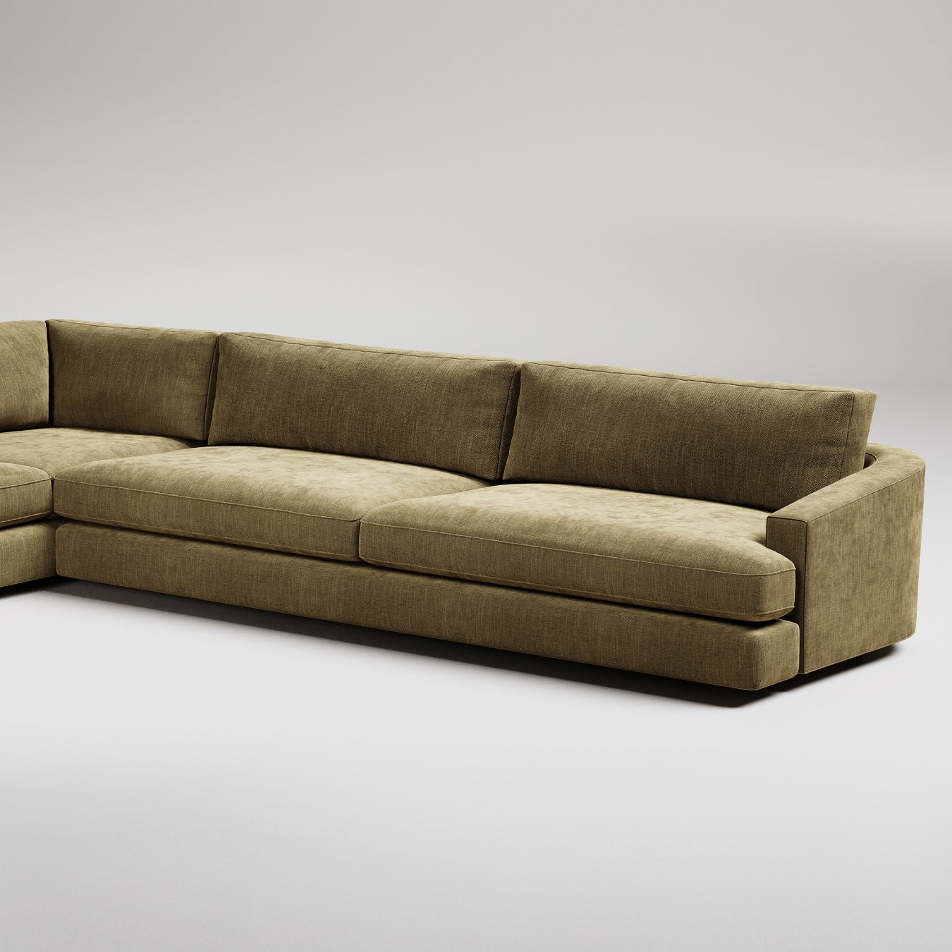 Modern olive green sectional sofa with clean lines and plush velvet upholstery against white background