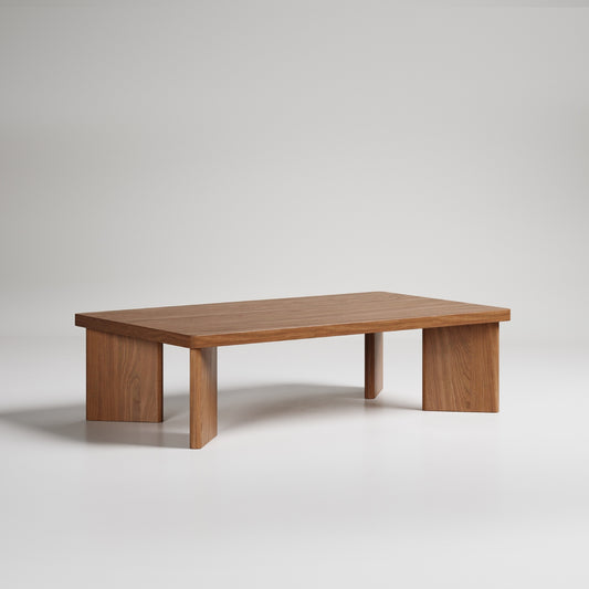 Modern rectangular coffee table with solid wood construction and minimal design, featuring thick block legs