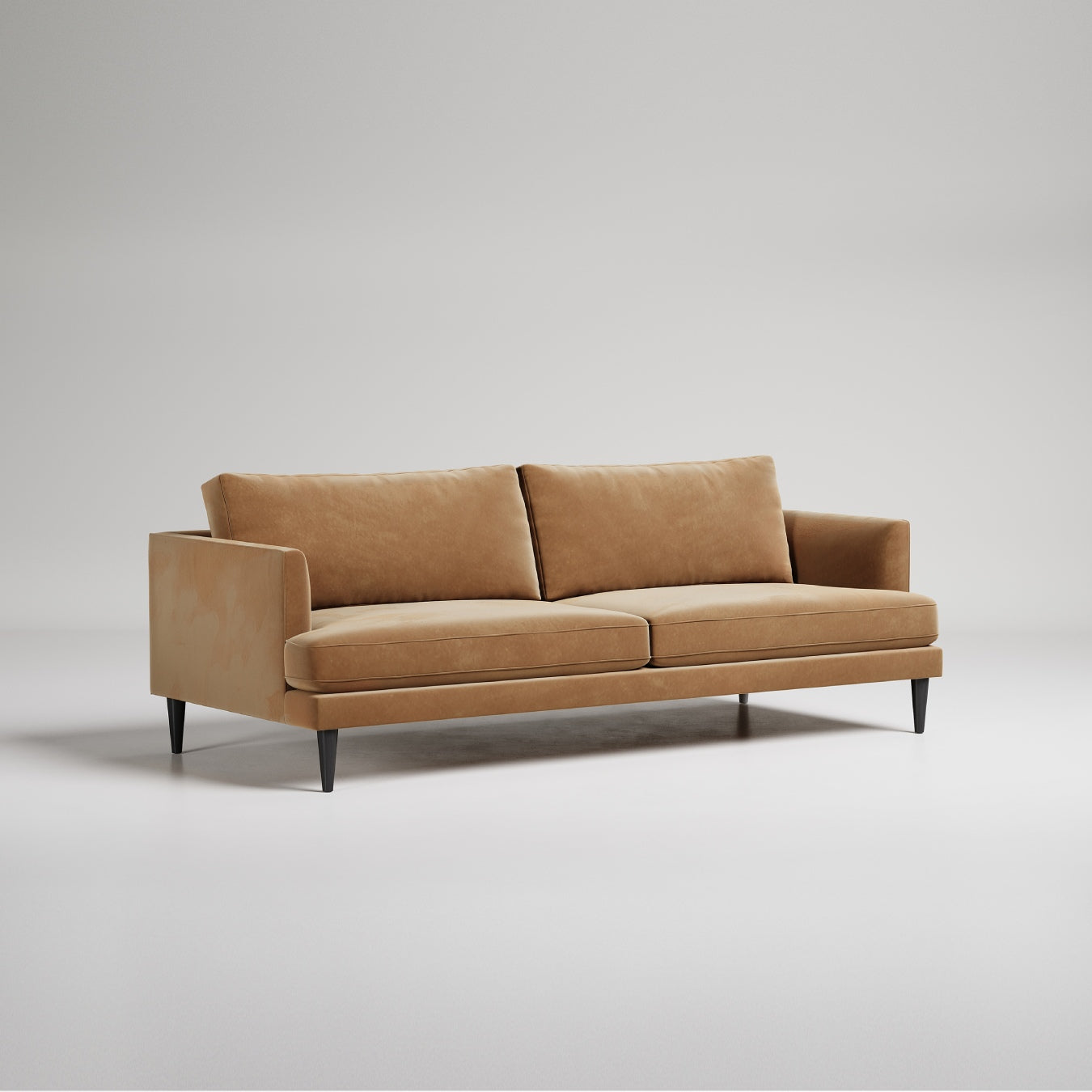 Modern tan velvet sofa with black legs on white background, contemporary minimal design studio photo