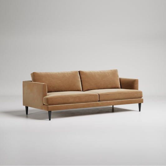 Modern tan velvet sofa with black legs on white background, contemporary minimal design studio photo
