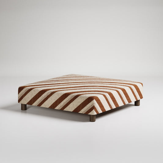 Patterned rectangular ottoman with fabric upholstery on white background, modern minimalist design