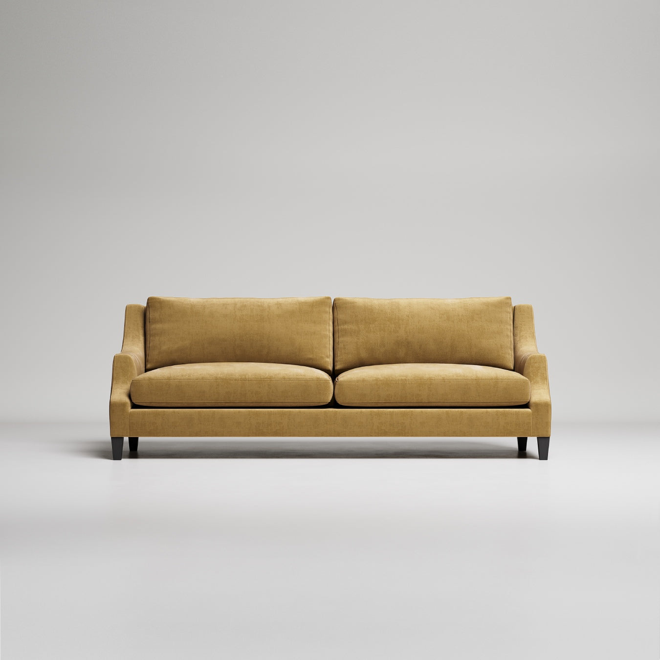 Modern gold velvet sofa with dark wooden legs on light gray background, studio product photo