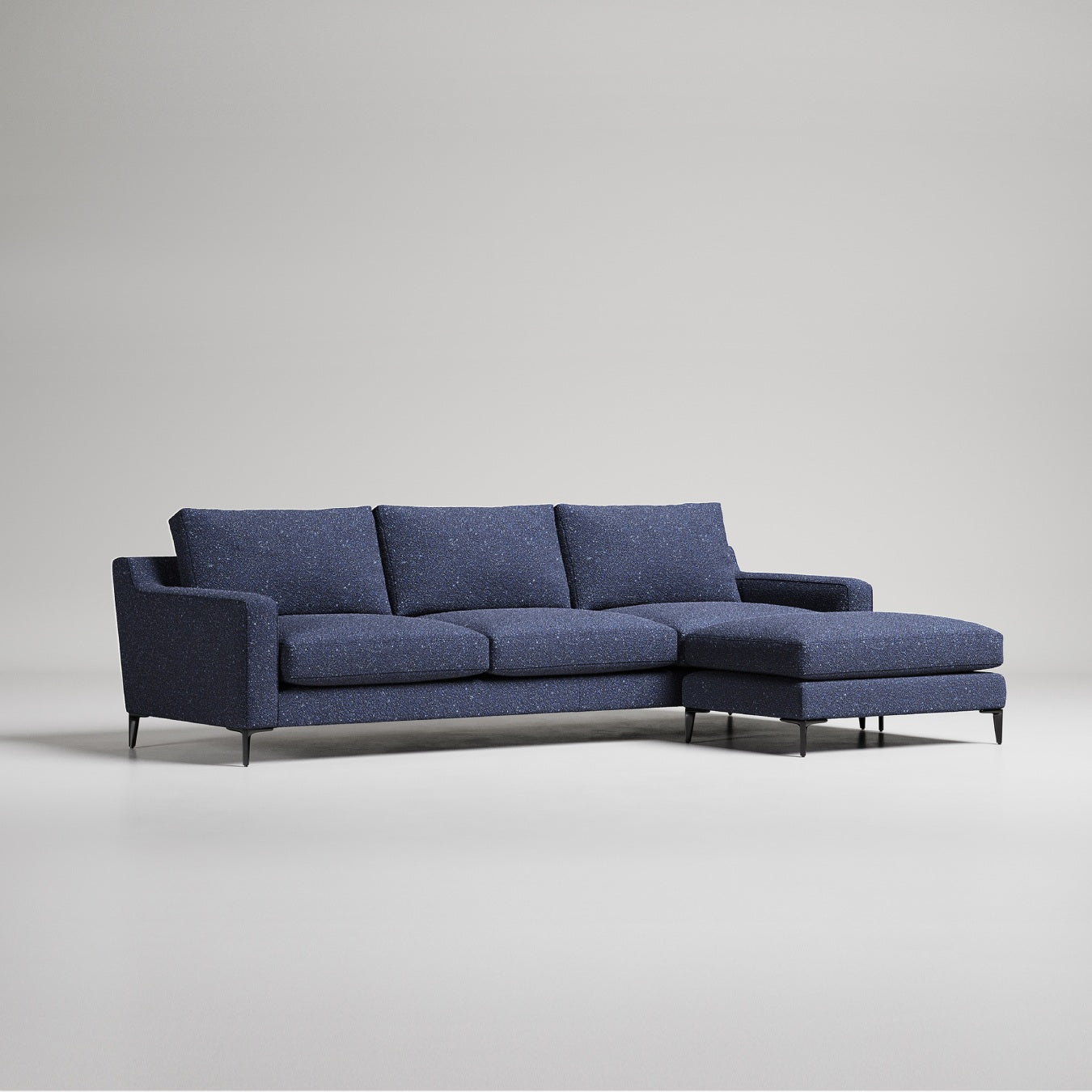Modern navy blue L-shaped sectional sofa with chaise lounge on metal legs against light gray background