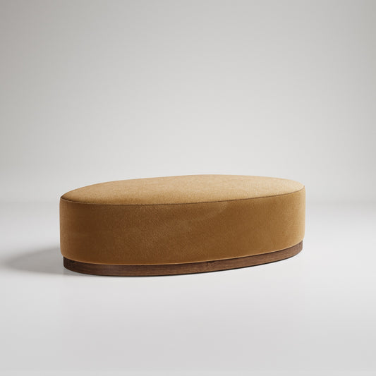 Oval tan velvet ottoman with wooden base against white background, modern minimalist furniture design