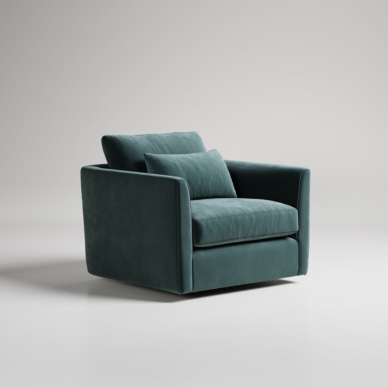 Modern velvet armchair in deep teal green with clean lines and single accent pillow, studio lighting