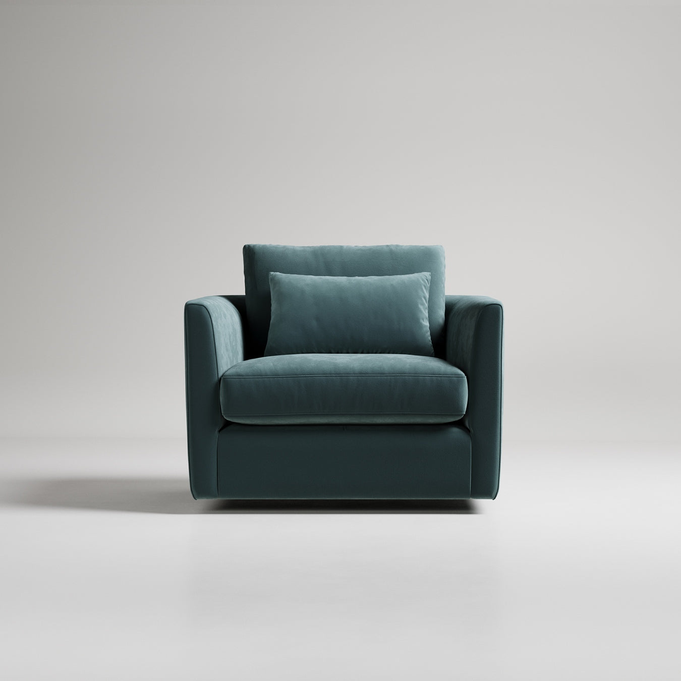 Teal velvet modern armchair with clean lines and matching throw pillow against light gray backdrop