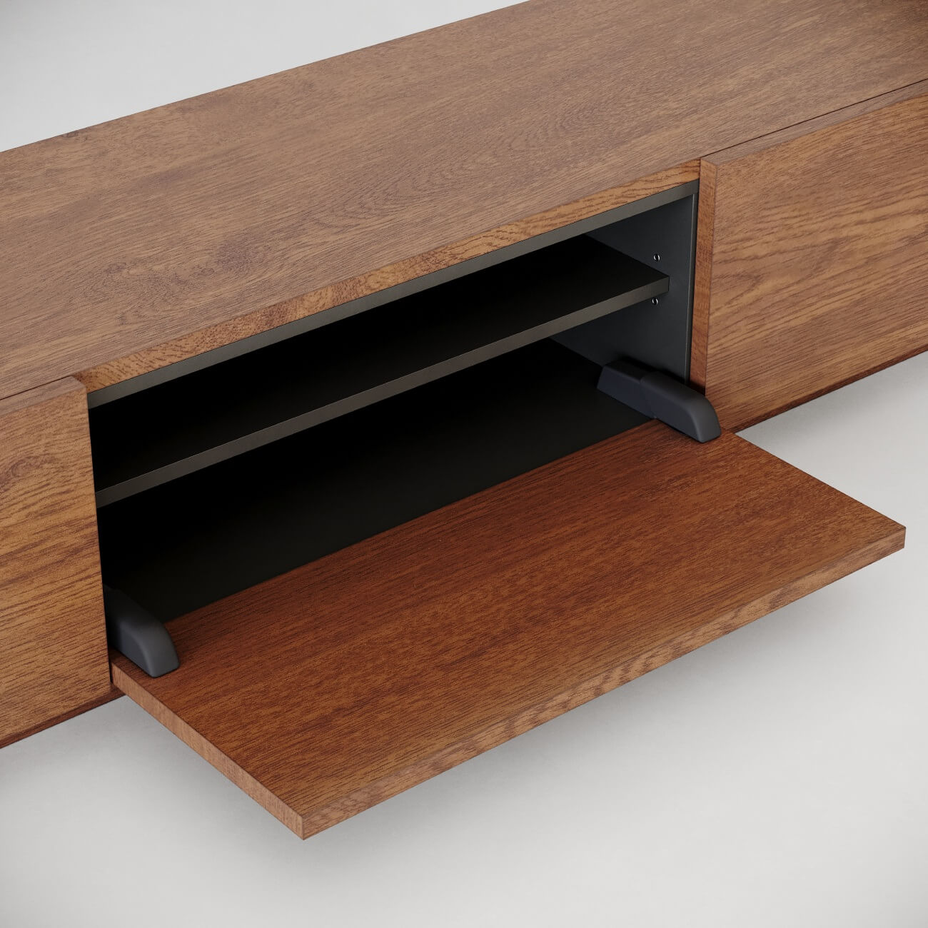 Wooden media cabinet detail showing drop-down door with black interior shelf and cable management system