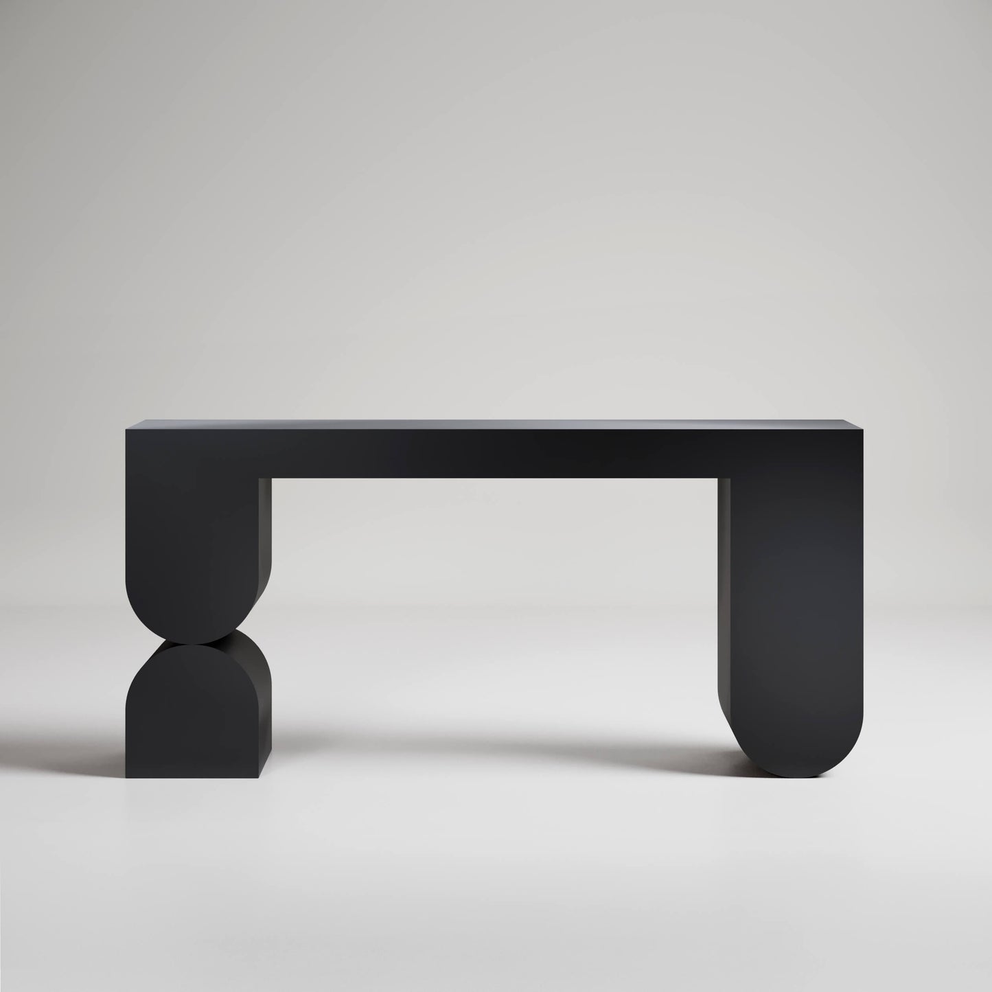 Modern black console table with geometric U-shaped legs and minimal design against light gray background
