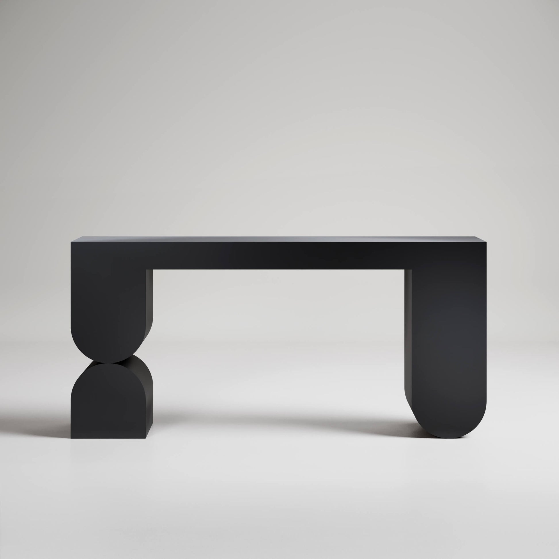 Modern black console table with geometric U-shaped legs and minimal design against light gray background