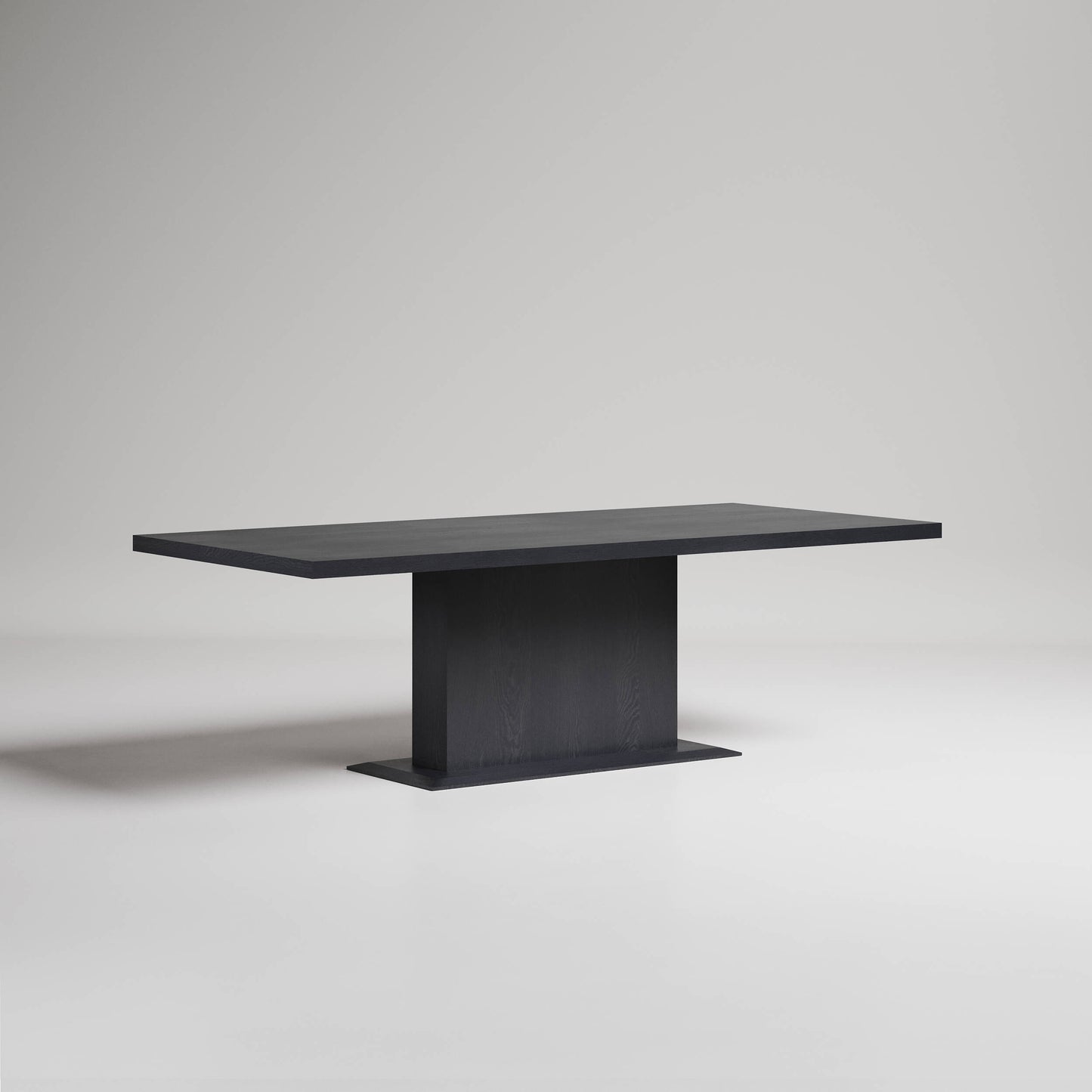 Modern black rectangular dining table with pedestal base on light gray background