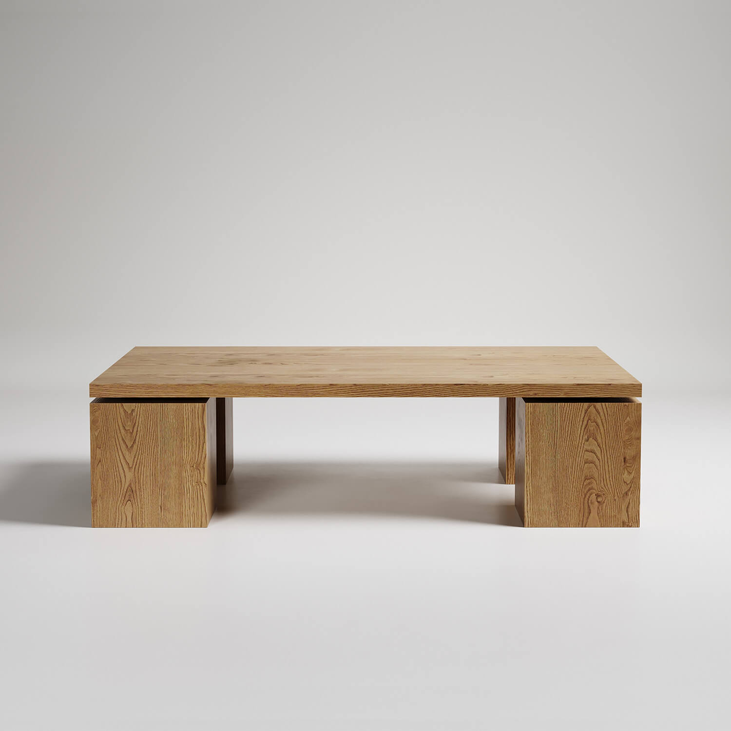 Modern minimalist wooden coffee table with floating top design supported by two cube pedestals against white backdrop
