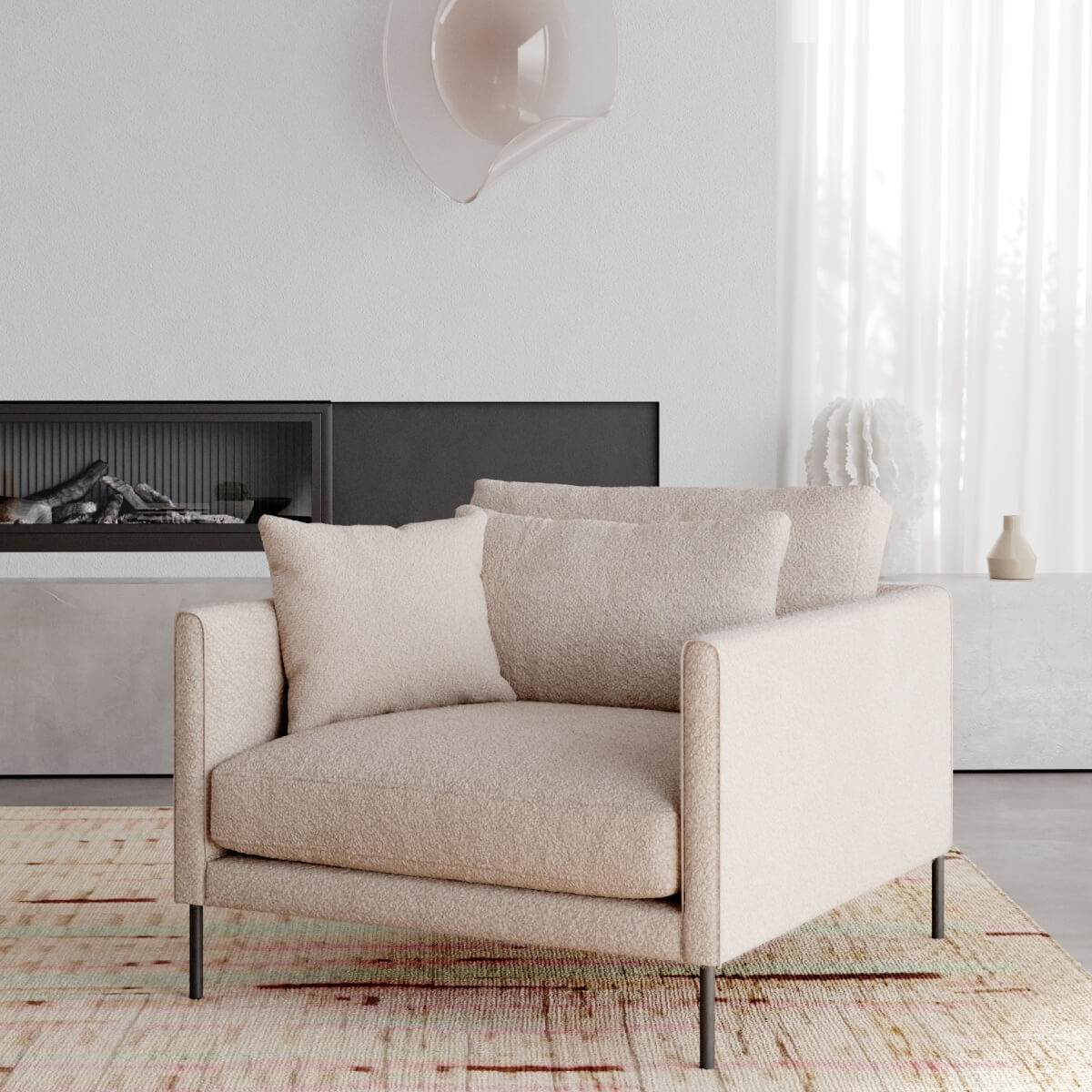 Modern cream armchair with textured fabric on metal legs, near fireplace in minimalist white room on vintage rug