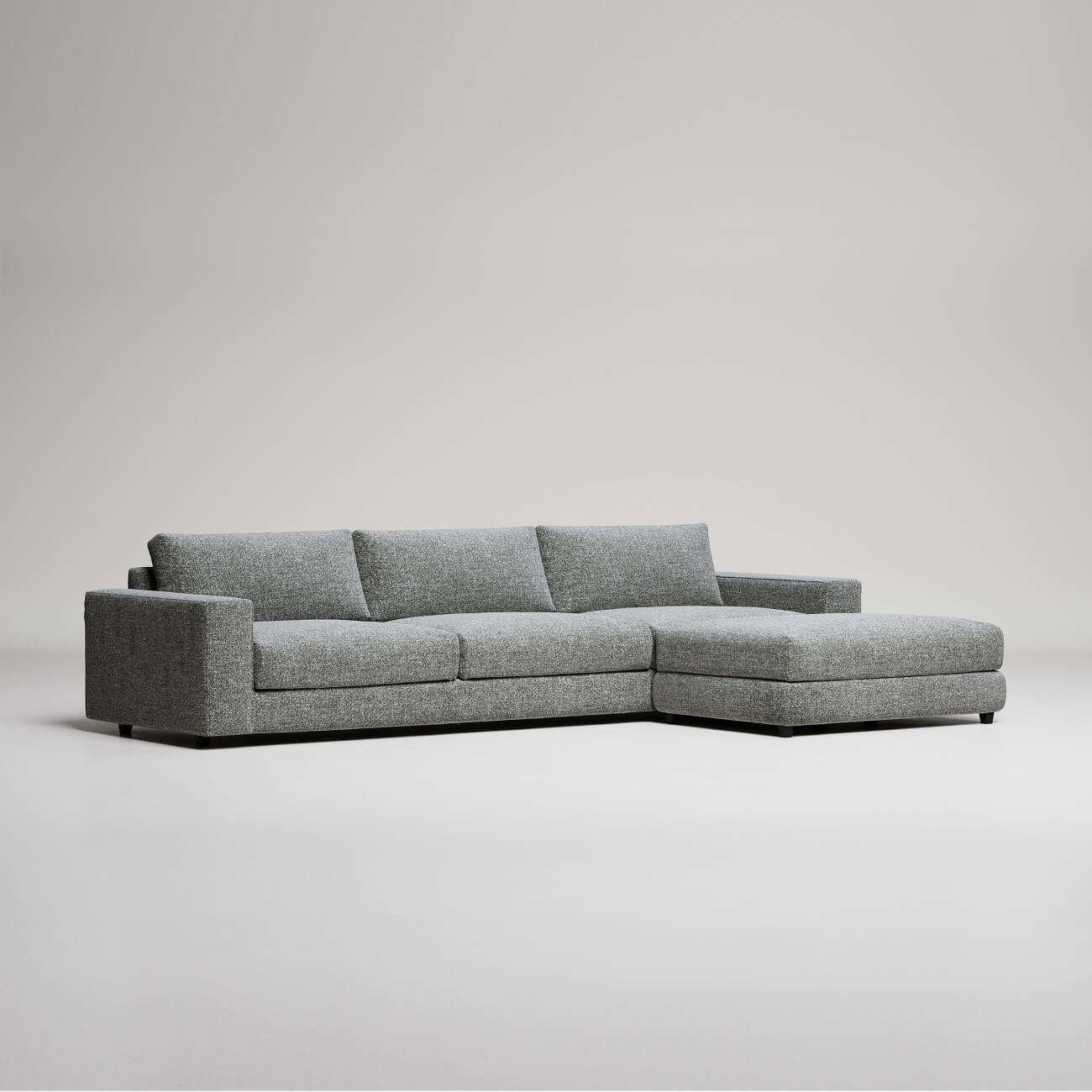 Modern L-shaped sectional sofa in heather gray fabric, clean lines, photographed against white background