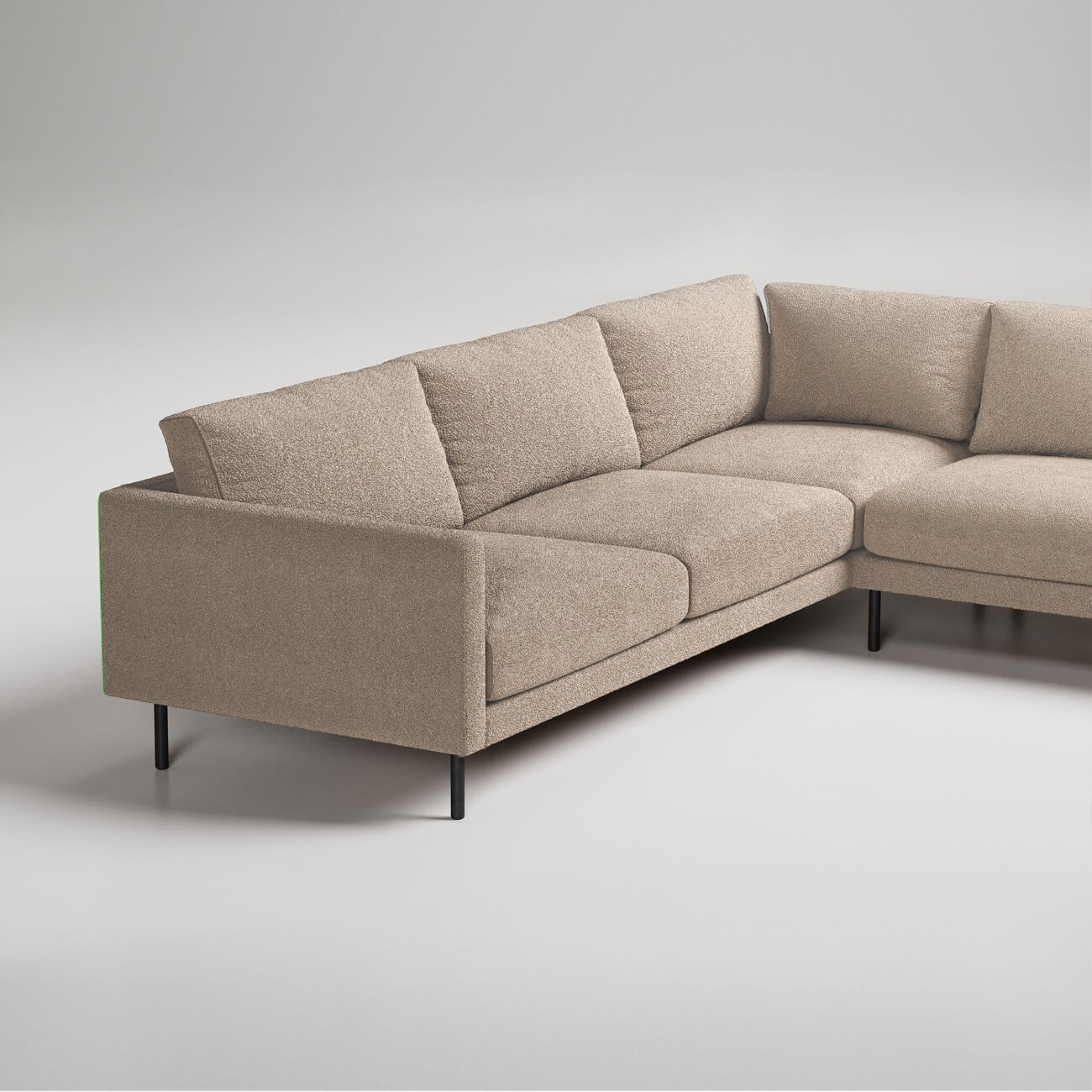 Modern L-shaped sectional sofa in beige fabric with black metal legs, photographed against white background