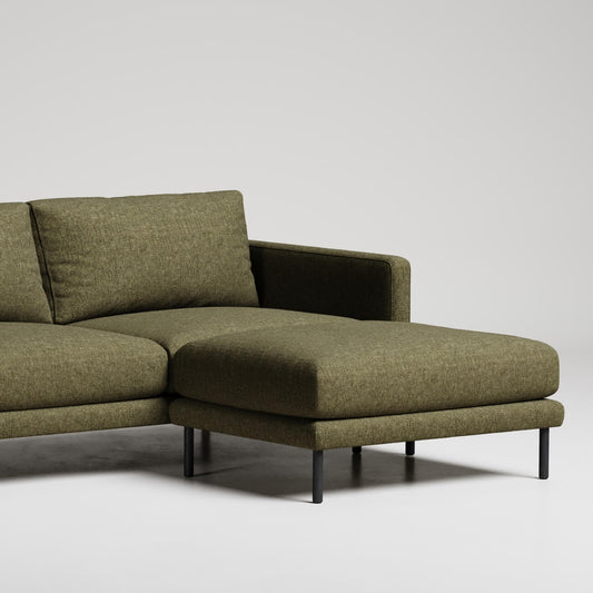 Modern olive green L-shaped sectional sofa with chaise lounge and black metal legs against white background