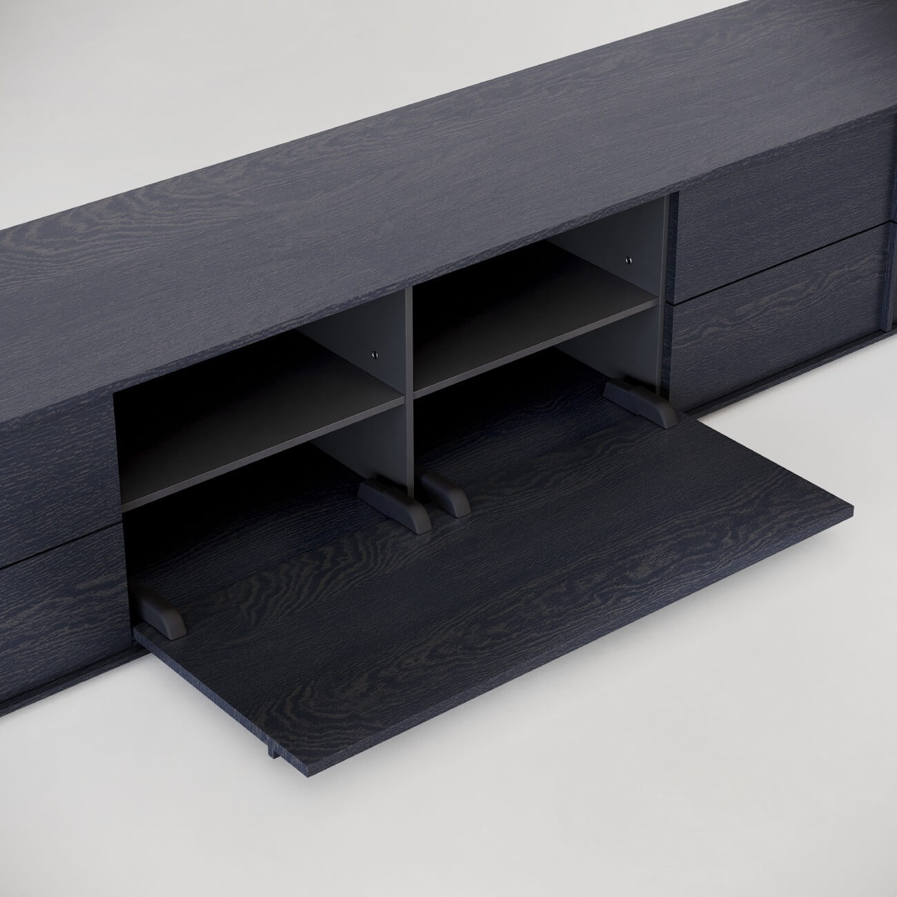 Modern black wood media console with drop-down door panel and interior storage compartments on white background