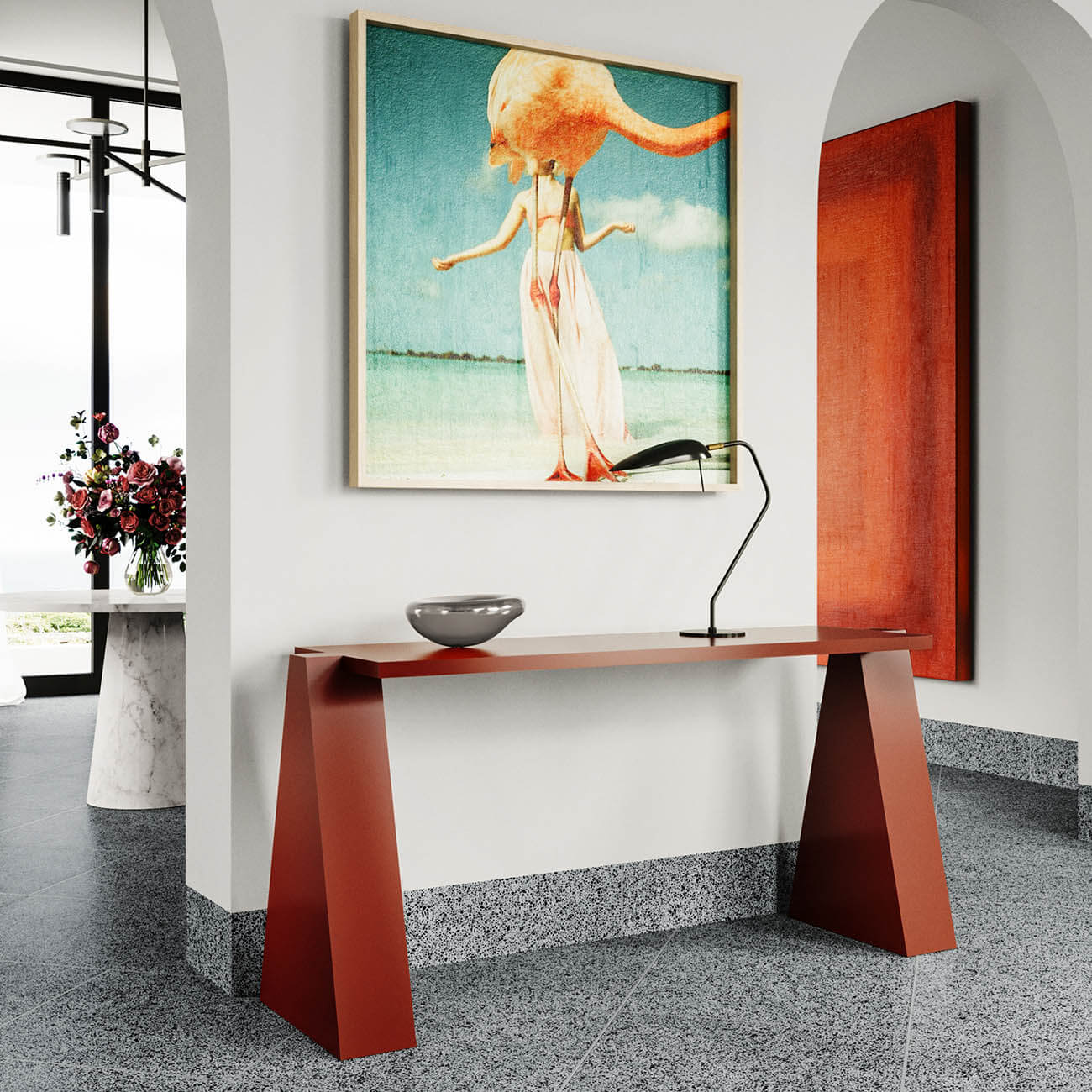 Modern entryway with red console table, surreal painting, flowers, white walls and terrazzo flooring