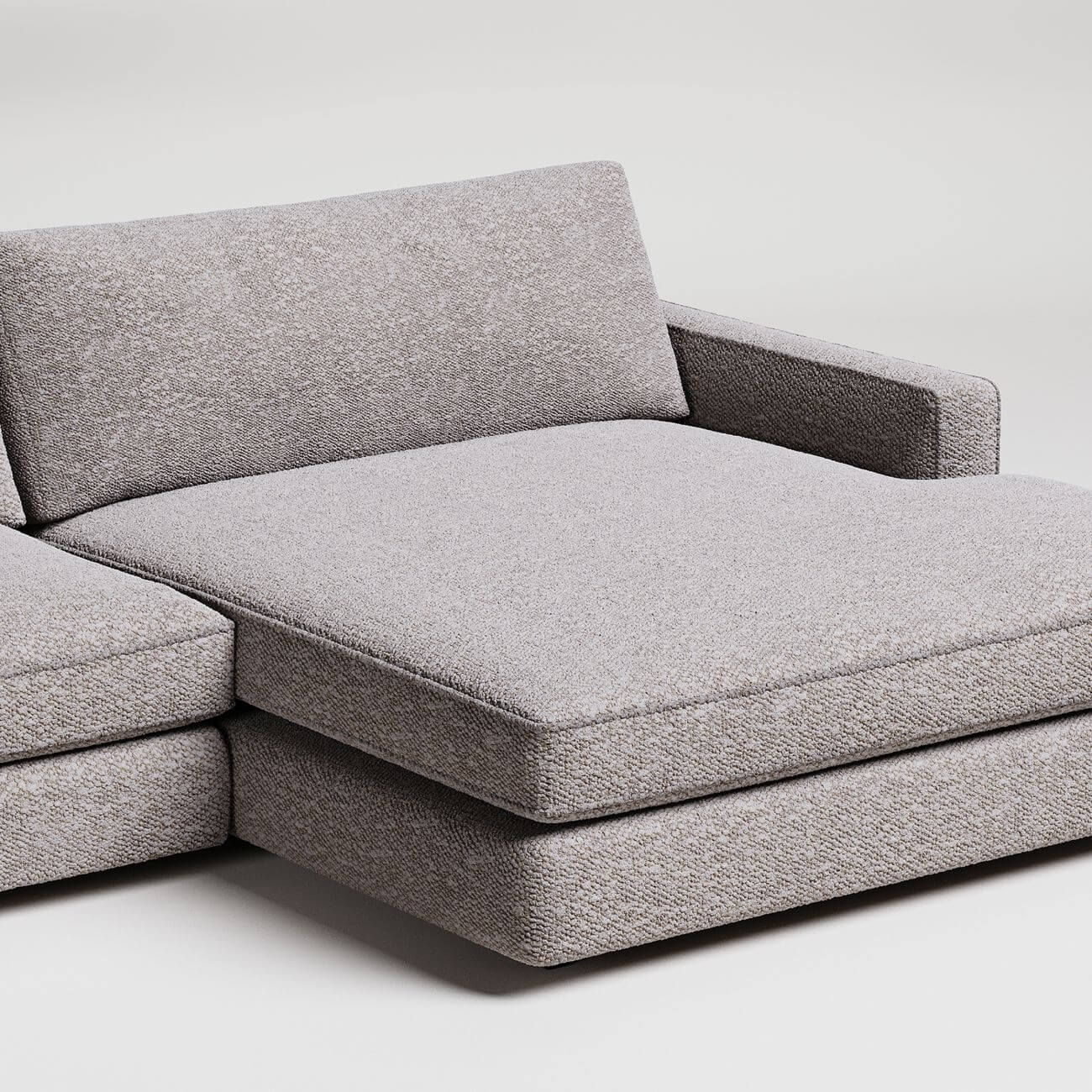 Modern gray L-shaped sectional sofa with wide chaise lounge, textured fabric upholstery, clean minimal design