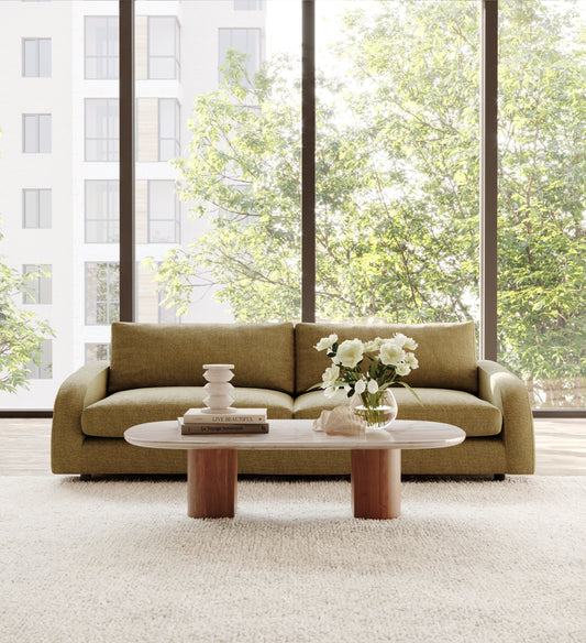 modern couch paired with textured cushions and throw