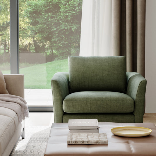 Custom handmade armchair beside bookshelf in quiet corner