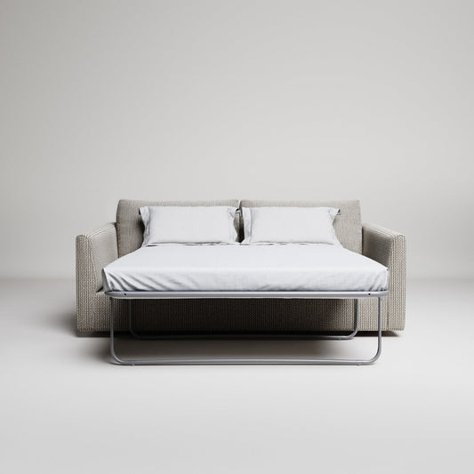 Minimalist sofa bed in neutral-toned living room