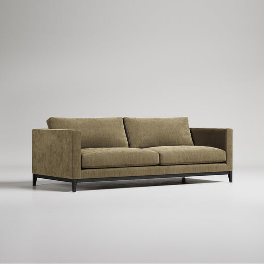 olive green two seater sofa with dark timber plinth