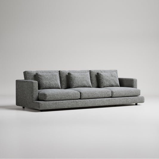 grey boucle sofa with three seat cushions
