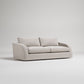 Light grey sofa with two seat cushions and rounded arms