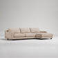 Beige sectional sofa on a light gray background