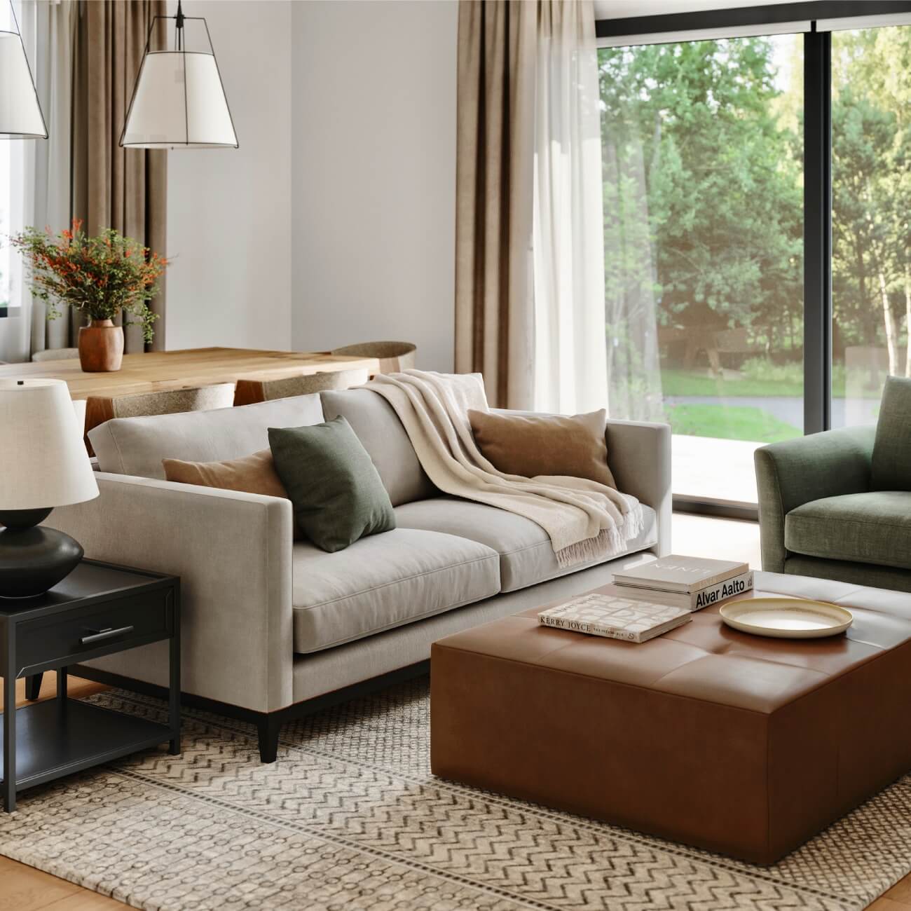 Light grey two seater sofa with cushions and throw in attractive living room