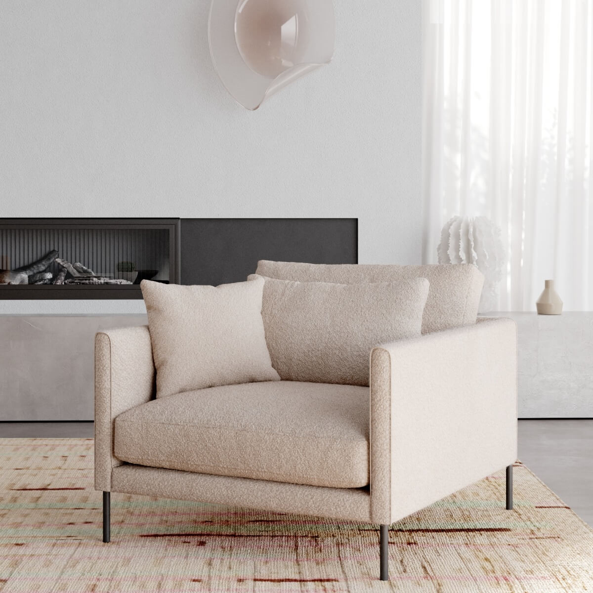 Square design armchair in cream boucle with slim arms and two cushions