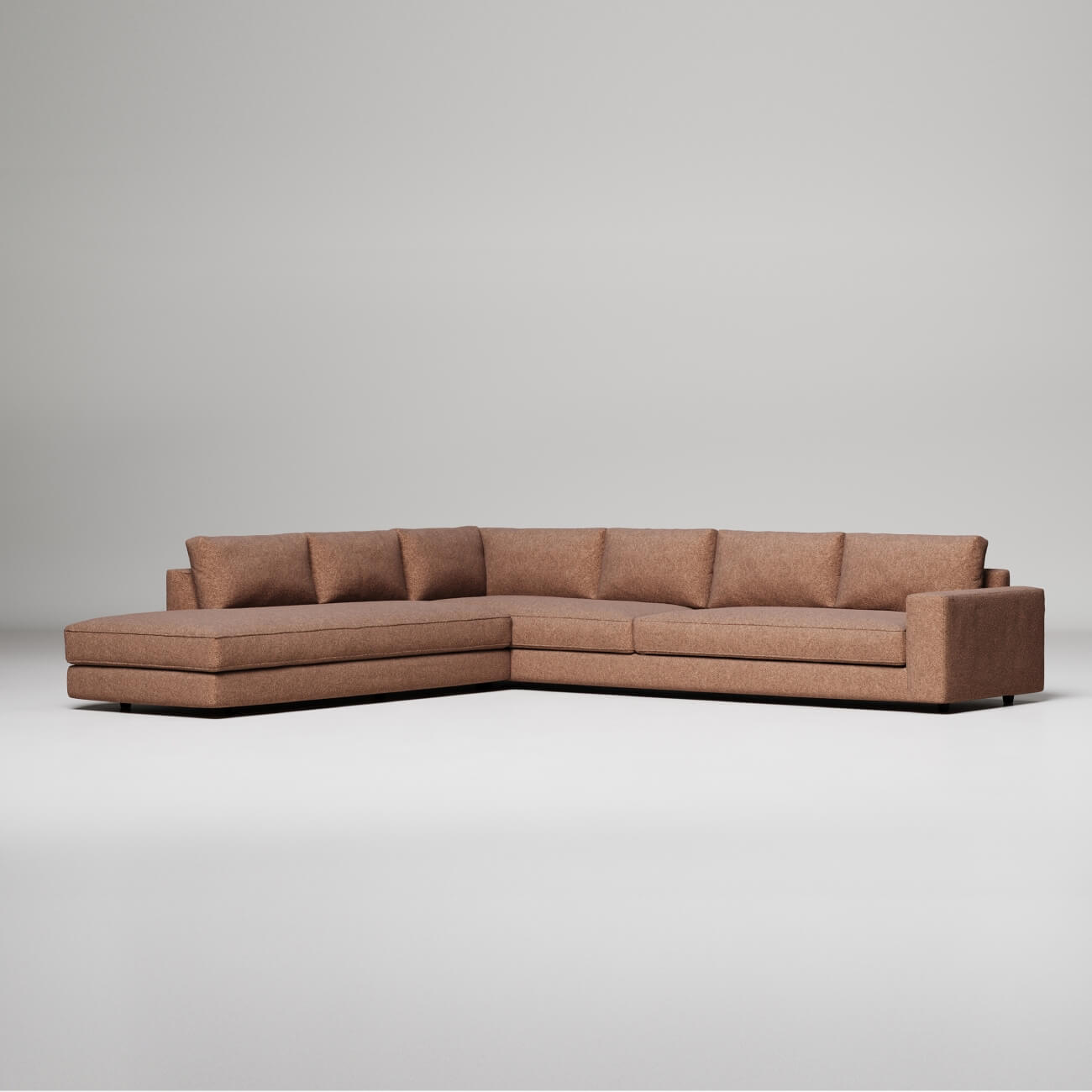 Large modular sofa in a light terra cotta colour